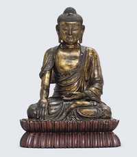 17TH CENTURY A LATE MING GILT BRONZE MODEL OF A SEATED BUDDHA
